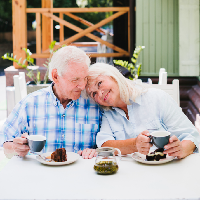 aged-couple-enjoying-time-together-drinking-tea-outdoors 1