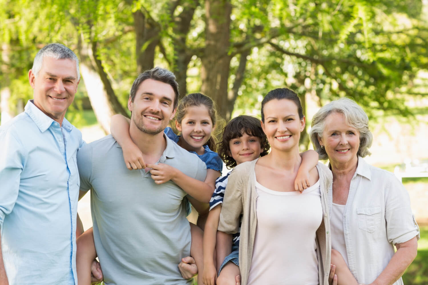 Family photo taken at the park showing healthy family members connected with Skiin.